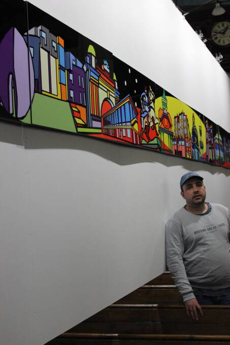 ART: Josh Muir stands with his eight metre long piece inside St Andrews Kirk. Picture: Ben Hopkins