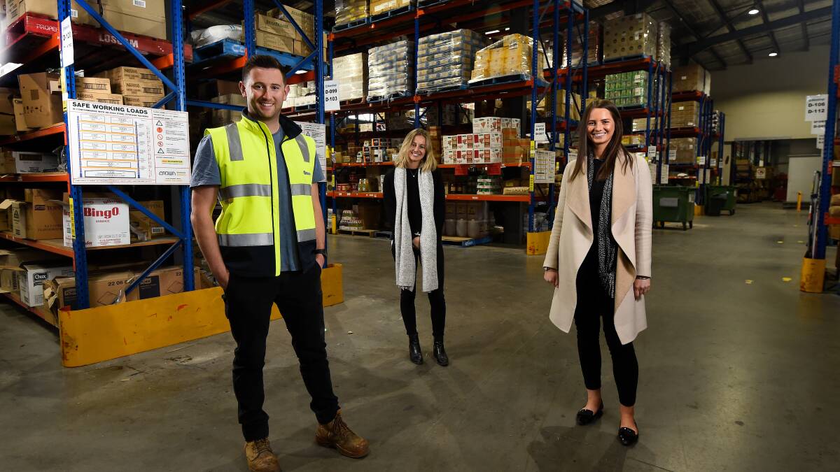 Ben, Sarah and Emily Wilkie inside the Natures Cargo warehouse.