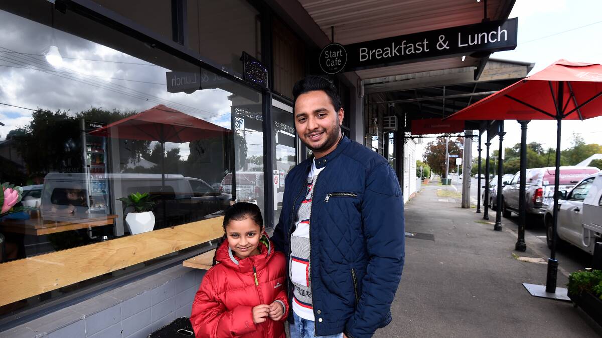 HELPING HAND: Owner of Start Cafe Raj Singh (right) which delivered free meals to elderly customers over the weekend. Picture: Adam Trafford.
