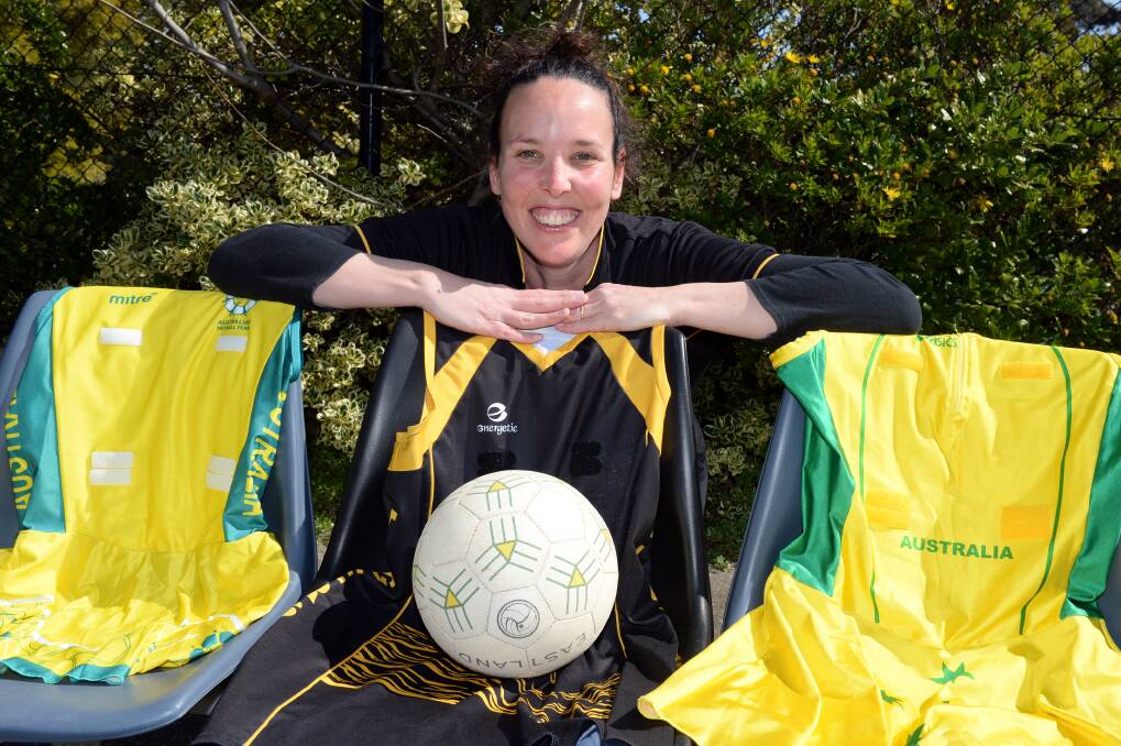 GOING OUT ON TOP: Cynna Kydd shows off her netball dresses from her 20-year career. Picture: Kate Healy.