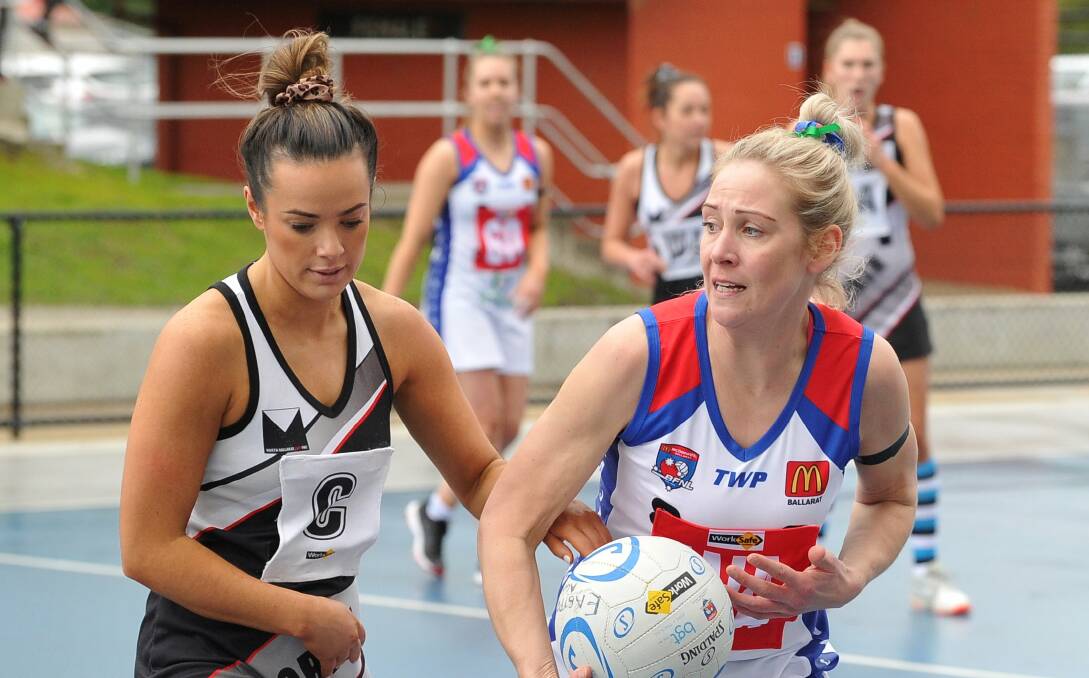 DEFENCE: North Ballarat's Gina Mccartin pressures East Point's Sarah Bourke in her sides eight-goal win on Saturday. Picture: Lachlan Bence 