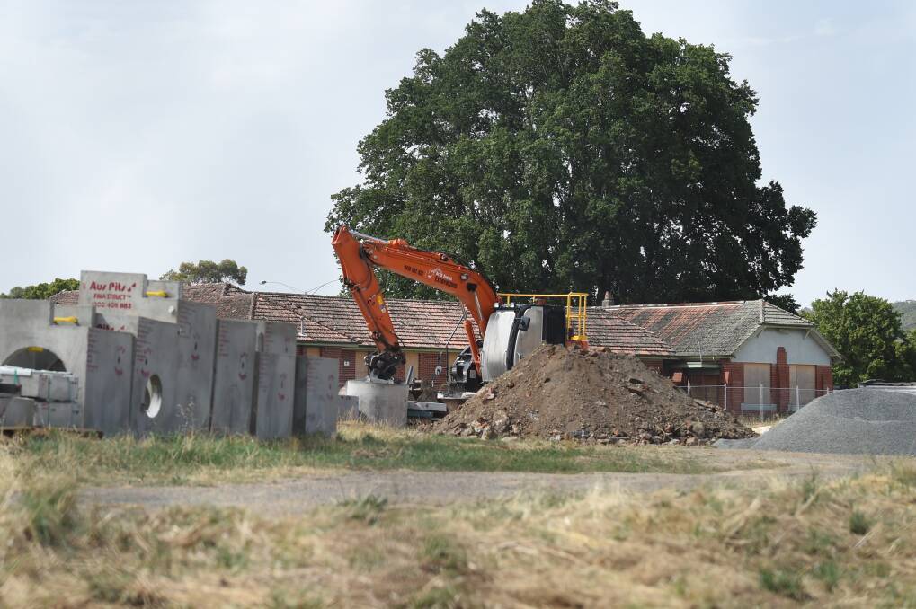 WORKS BEGIN: An excavator clears earth as works begin at the site of the former Ballarat Orphanage. Picture: Kate Healy.