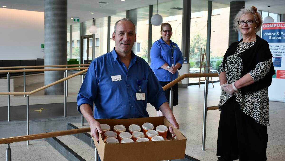 COFFEE: BHS paediatrics ward manager Clinton Griffiths, clinical support Gayle Clark, and Turret manager Carmel West with pay it forward coffees for hospital staff. Picture: Alex Ford.