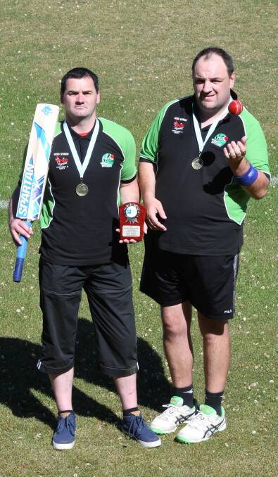 CHAMPIONS: David Jenkins, left and Mark Prebble show off their first-place medals from the Mildura All Abilities Cricket Carnival. Picture: Lachlan Bence.