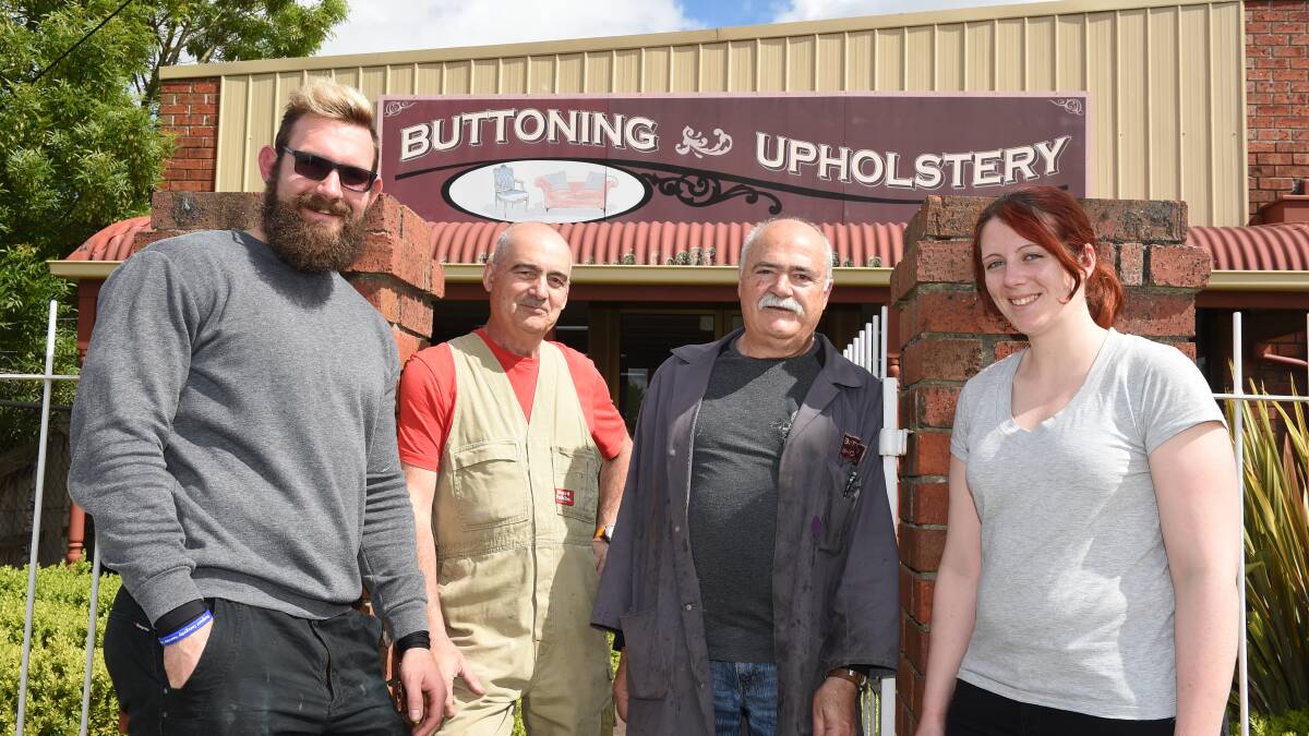 Buttoning Upholstery owners Angelo and Chris Christofi (centre) with employees Mark Snel and Marie Pigott. Picture: Kate Healy 