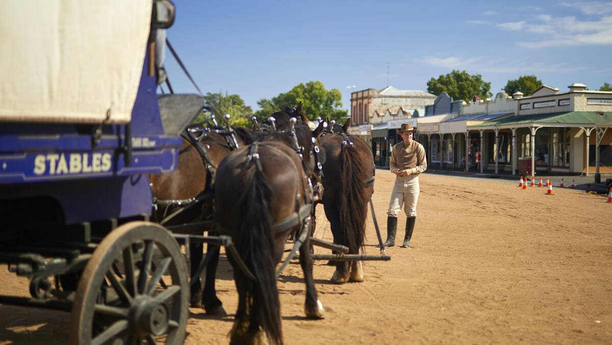 Transformation: The cast and crew of Picnic at Hanging Rock have taken over the main street of Clunes for two days of shooting.  Picture: Luka Kauzlaric.  