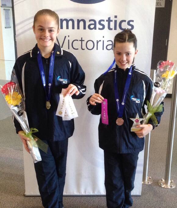 Impressing the judges:  Thirteen-year-old Adele Brand and 11-year-old Claire Lightfoot placed third and fourth respectively in their categories at the Victorian Gymnastics Championships on the weekend.