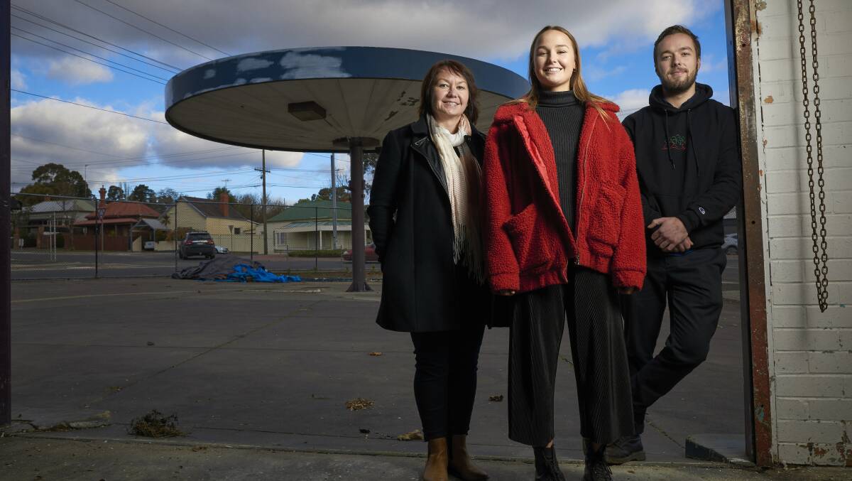 Caffeine heads to Golden Point: Sam Fraser, Ruby Staley and Jarrah Staley at the former petrol station on the corner of Grant and Barkly streets, which they plan to transform into a cafe. Picture: Luka Kauzlaric 