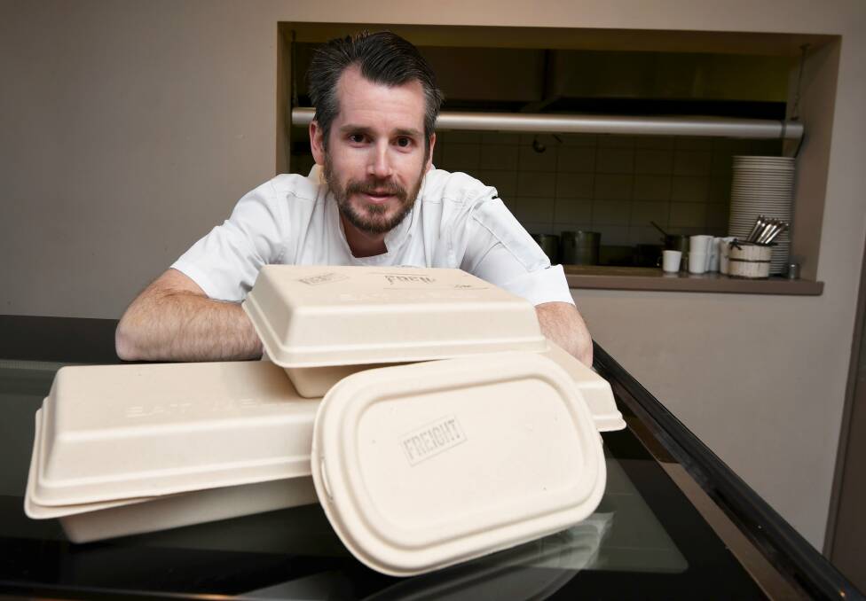 Cutting down waste: Freight Bar and Restaurant chef Chris Watt shows off the new compostable takeaway containers the business is using in place of single-use plastic. Picture: Lachlan Bence 