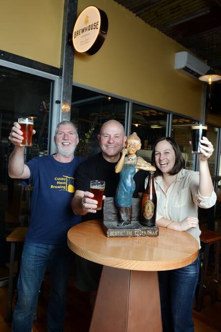 A beer with Bertie: Cubby Haus Brewing's Malcolm Sachs, Athletic Club Brewery's Peter Parry and the Ballaarat Mechanics Institute's curator Amy Tsilemanis enjoy a drop.  Picture: Kate Healy.    