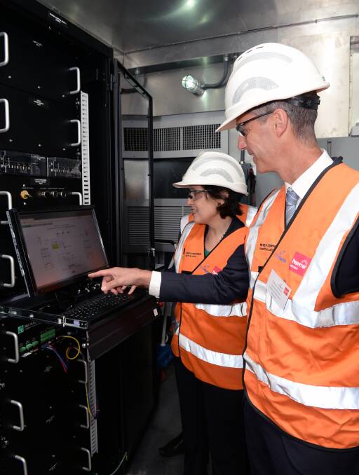 Flicking the switch: Energy and resources minister Lily D'Ambrosio with Powercor Australia general manager of electricity works Steven Neave.  Picture: Kate Healy.