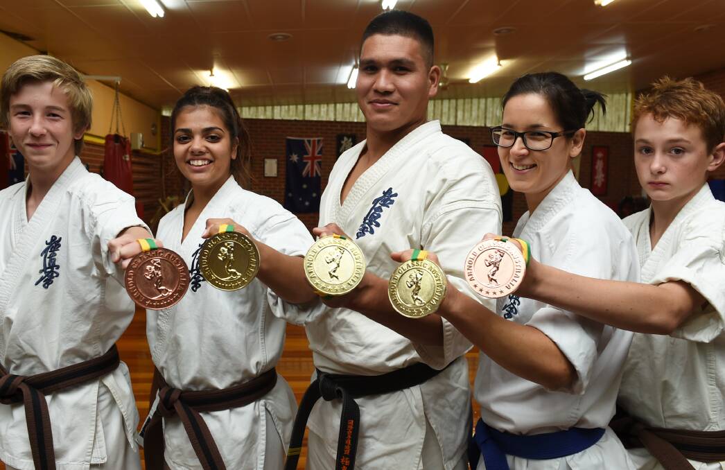 Winners: Jake Smith,14, Thiilyaana Jones, 16, Mohammad Rezaie, 27, Camilla Barker, 35 and Jayden Wallis, 13, with their medals.  Picture: Lachlan Bence.