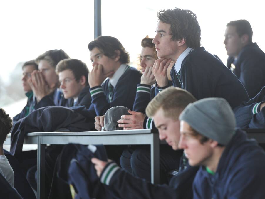 Listening intently: The St Patrick's College squad listen in as coaching staff run through the game plan for the Herald Sun Shield final. Picture: Lachlan Bence.  