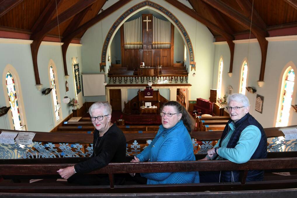 End of an era:  Pleasant Street Uniting Church members Alison Cook, Lynne Jelbart and Margaret Bennett take in the beauty of the grand building ahead of its closure at the end of this month. Picture: Lachlan Bence 