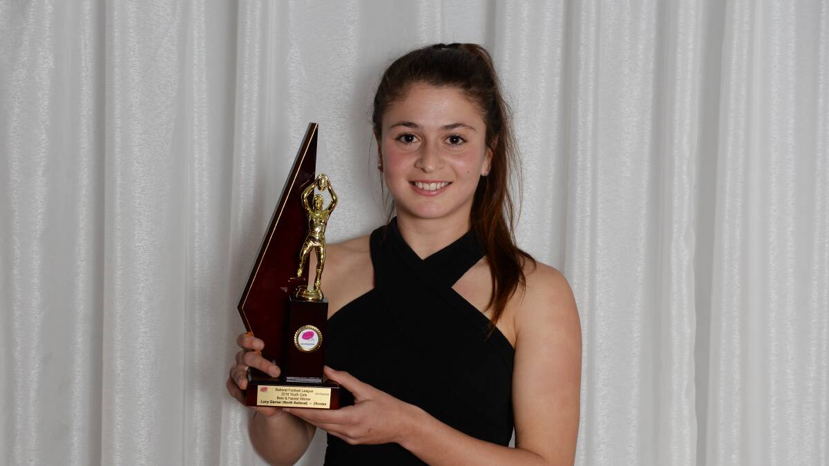 Lucy Garner with the best and fairest trophy.  Picture: Kate Healy.   
