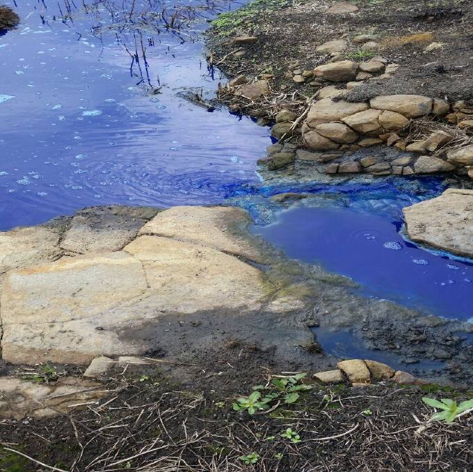 Bright blue: A substance which spilled at the UniGrain Smeaton premises turned a nearby creek a particularly unnatural shade of blue.  Picture: Supplied. 