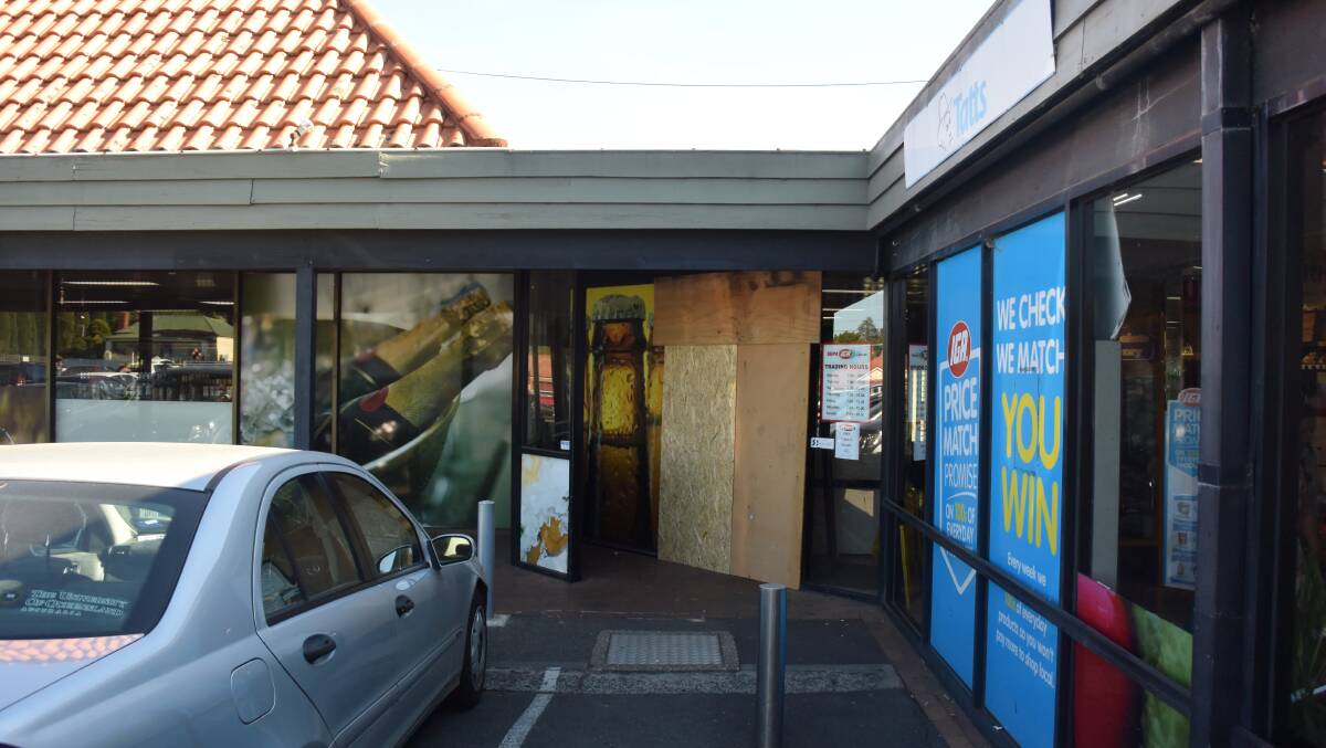 The boarded entry to Ryans IGA Liquor at Northway 