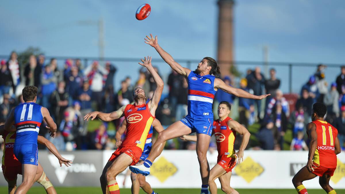 Jarrod Witts of the Suns and Tom Boyd of the Bulldogs compete for the ball. Picture: Dylan Burns 