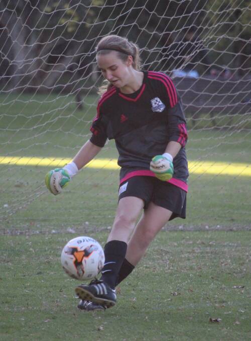Just short: Goal keeper Kate Lyons in action for the Strikers.  Picture: Supplied.