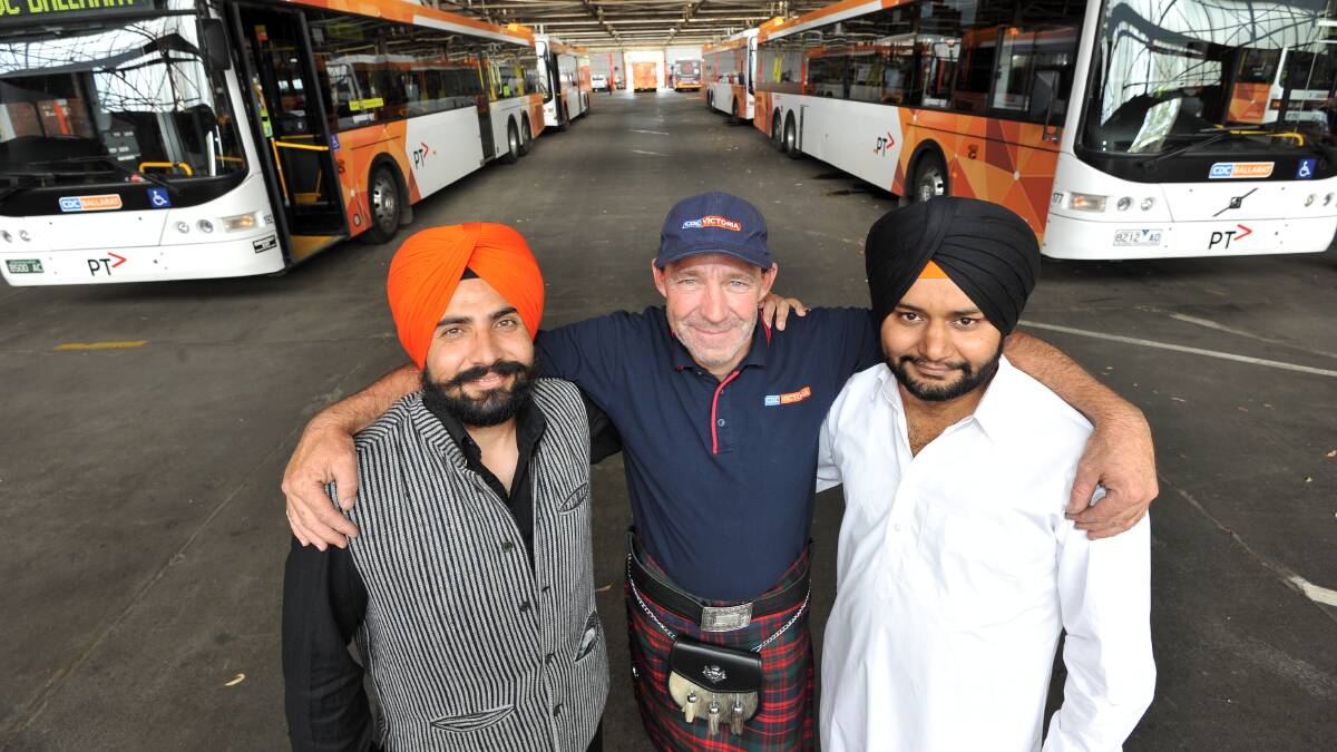 Diverse bunch: CDC bus drivers Amandeep Singh, Shane Ansell and Amolakjit Singh will all be in traditional dress when they're out on the road on Friday.  Picture: Lachlan Bence. 