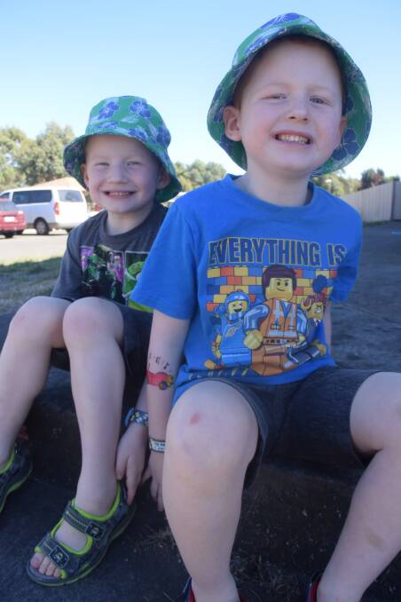 All smiles: Five-year-old twins Liam and Rhys Allen made the most of the good weather on Sunday with a ride on a miniature train at the Invermay Miniature Railway Complex.  Picture: Brendan Wrigley. 