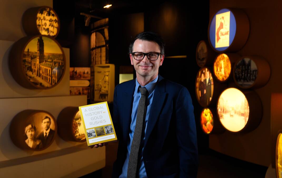 Launch of the book 'A Global History of Gold Rushes' at the Gold Museum: Co-author and historian Dr Benjamin Mountford poses for a photo with a copy. Picture: Adam Trafford