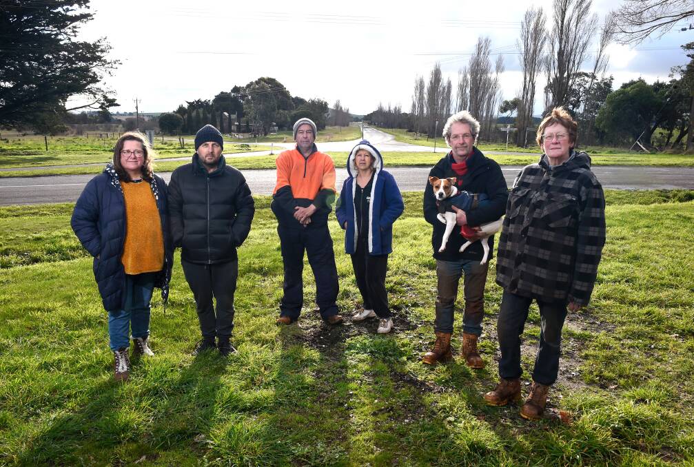 Local support: L-R - Kingston local residents Nicki and John Laursen, Wayne Coates, Jan Worthington, Mark Myers with dog Frankie and Carolyn Garvey at the intersection, which will receive a $456,000 upgrade. Picture: Adam Trafford.