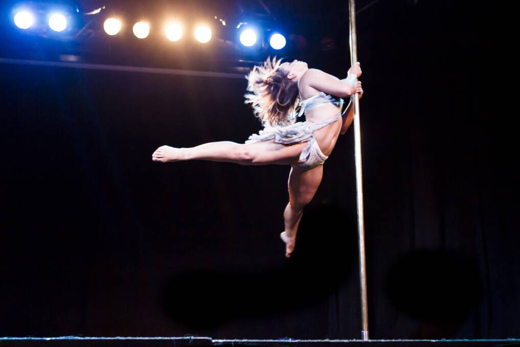 Utterly physical: Kristy Sellars performs a routine on the pole.