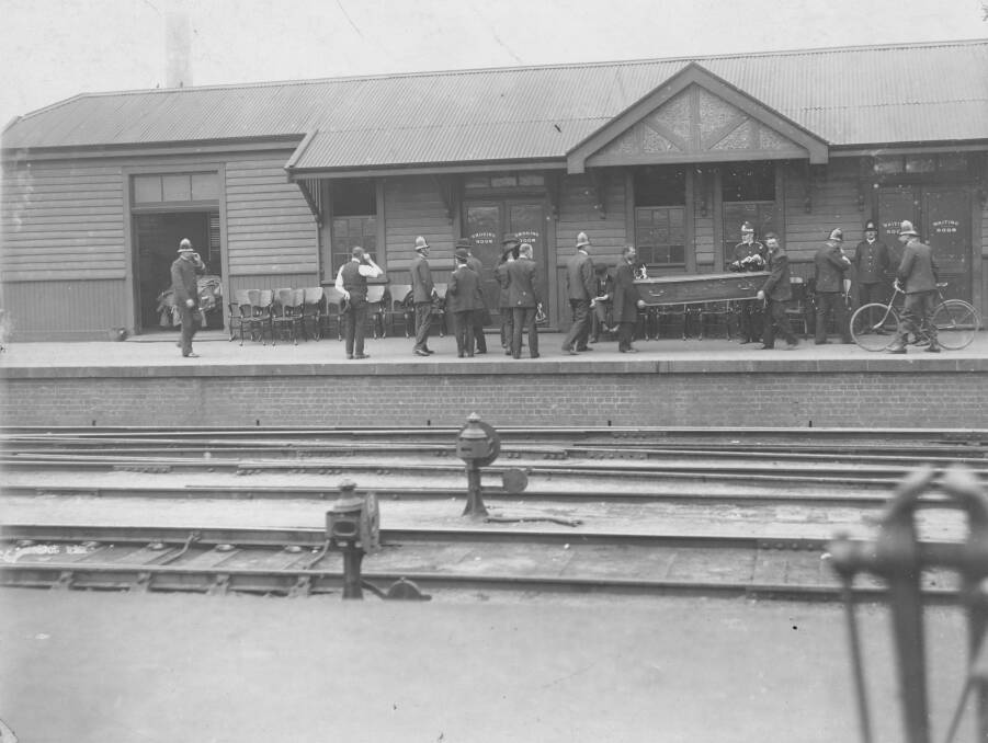 Awful scenes: Police transporting coffins at Spencer Street Station following the accident. Picture: National Library of Australia.