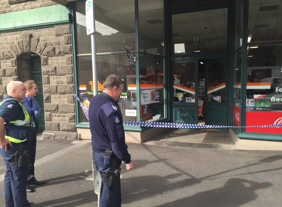 Syringe: Ballarat police outside the scene of the alleged hold-up in Lydiard Street. Photo: Caleb Cluff.