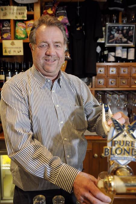 The publican's publican: Ian Larkin behind the bar of Irish Murphy's. Mr Larkin owned and managed several hotels in Ballarat over 40 years. Picture: Adam Trafford.