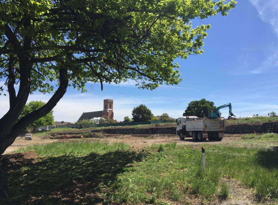 Clearing for works: The St Paul's Way development is underway, with the former church and school site cleared on Wednesday for groundworks. Several large trees were felled, but others remain on the perimeter. Picture: Caleb Cluff.
