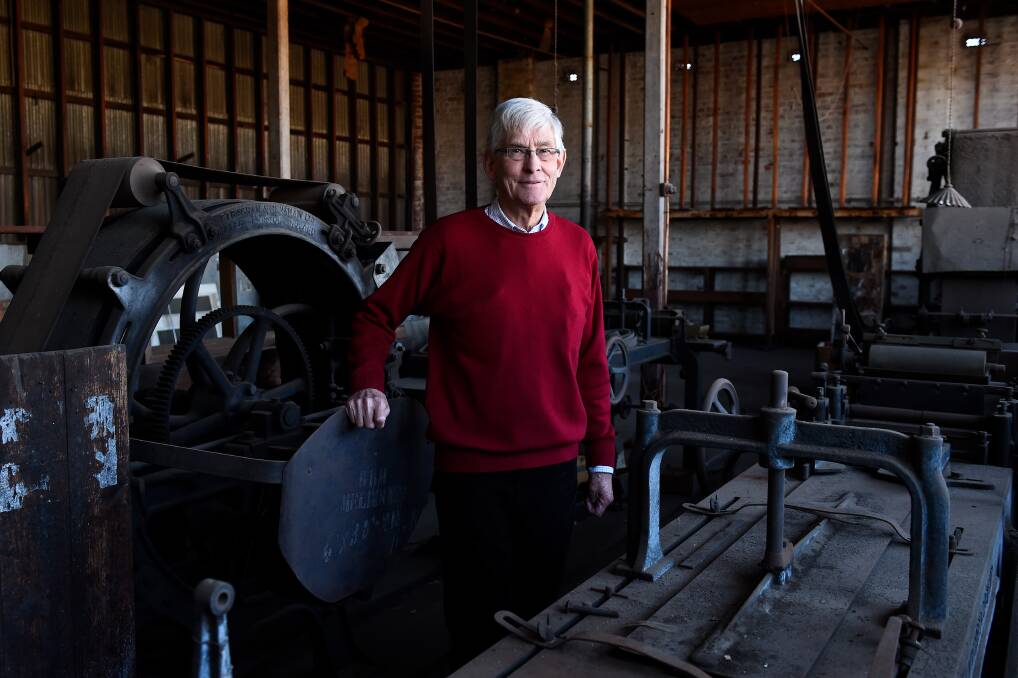 A Ballarat institution: Henry Berry stands among antique bag making machines in the Dana Street building which was built for the printer in 1902. Picture: Adam Trafford.