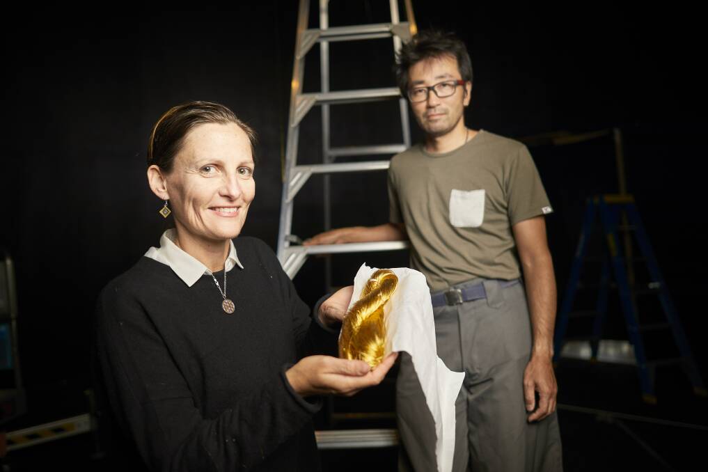 GOLD: Artists Julia and Ken Yonetani with the 24 carat gold thread they will transform into a giant pyramid at the Eureka Centre for the Biennale of Australian Art. Picture: Luka Kauzlaric
