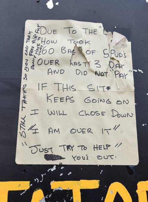 Angry: The note left by a potato grower on a roadside stall outside Ballarat after the stall was robbed this week. Online sales are a solution. Picture: Adam Trafford.