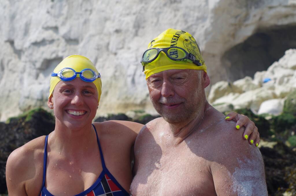 Success: Champion swimmer and coach Chloe McCardel with Rick Seirer on the beach after his 30 hour marathon crossing. Pictures: Chloe McCardel.