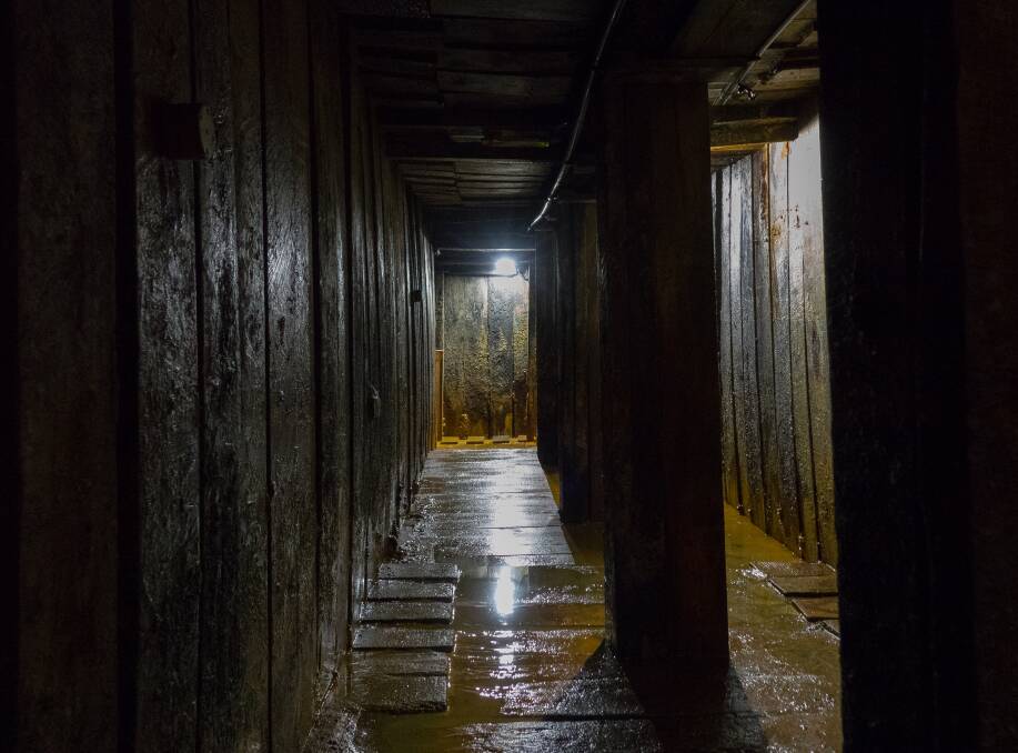 Dark and dangerous: Inside a restored World War One tunnel in Belgium. Picture: Yvon Davis.