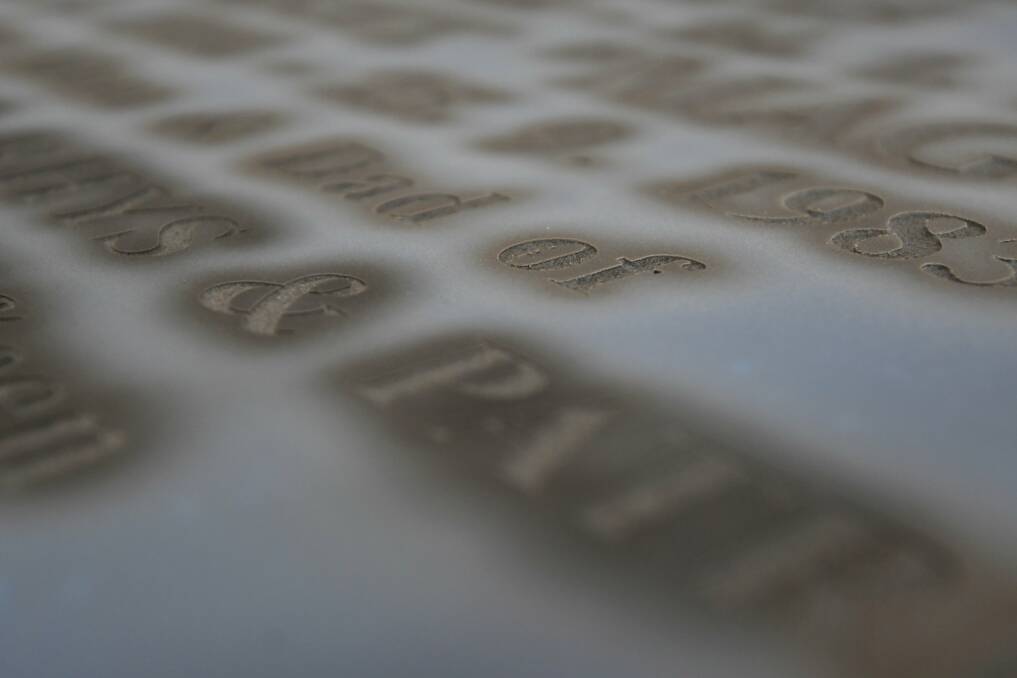 Template: Once hand-cut, sand is now blasted over this to cut lettering into the stone.