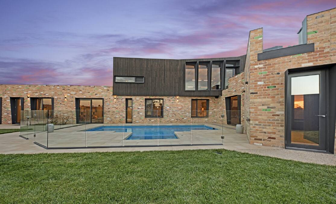 Strong feature: recycled brick - five different styles - makes a strong statement throughout the home.