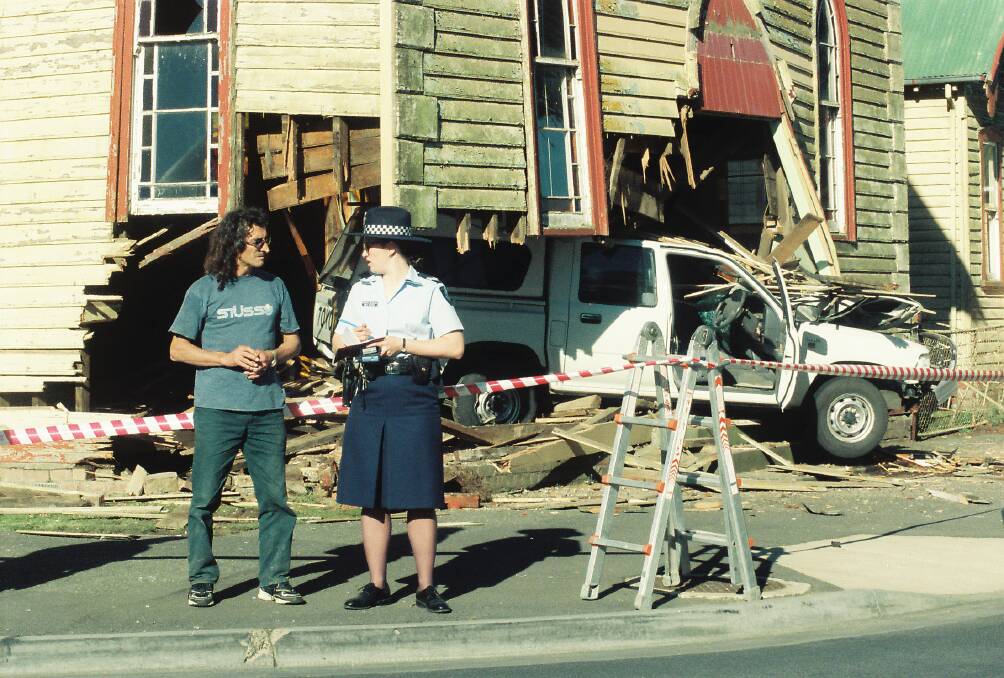 Witness: a police officer takes details at the scene of the crash at the Jubilee Church in 1999. The driver failed to negotiate the roundabout after suffering a seizure.