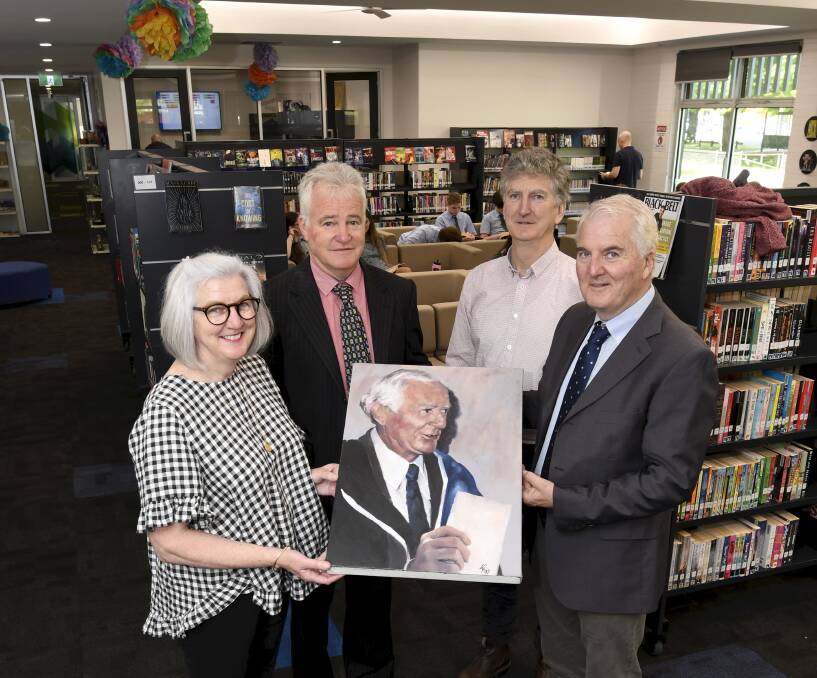 Cate Cook, BHS principal Garry Palmer, Damien Sheehan and Mark Sheehan with the portrait of JJ Sheehan. Picture by Lachlan Bence.