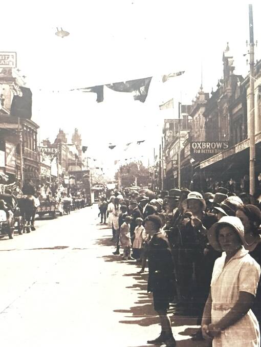 Floral Festival: Huge crowds lined Ballarat's streets for a parade in 1938 celebrating the town's centenary. Picture: Max Harris Collection.