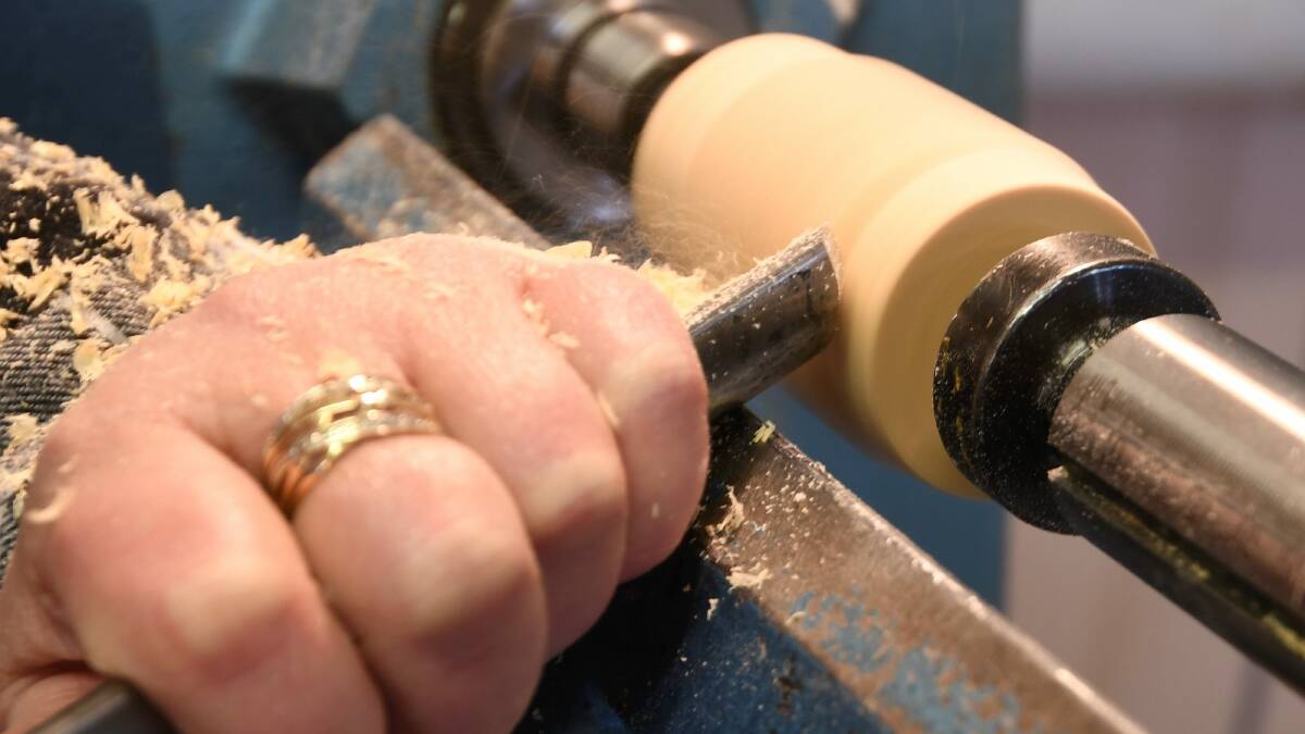 Close up: Erika Pugh carving a tool handle. Picture: Lachlan Bence.