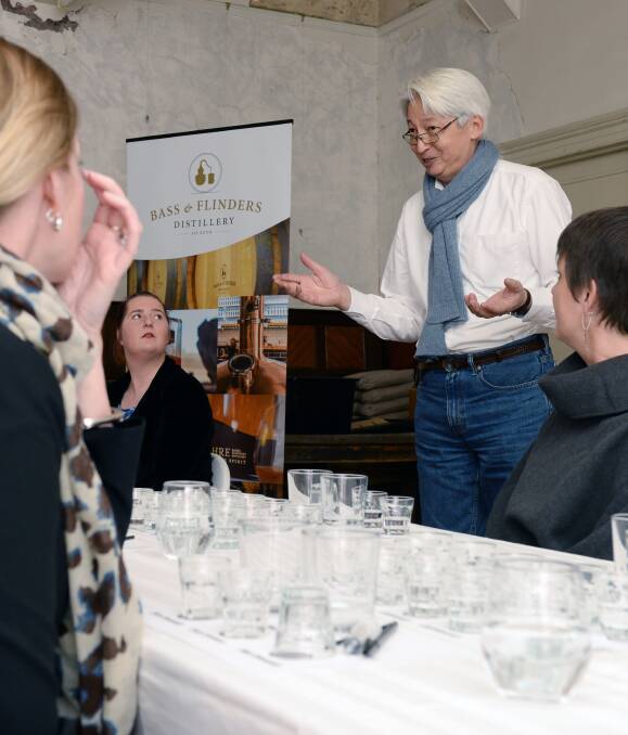 Variety of aromas: Wayne Klintworth explains the subtleties of flavour in a quality gin. At least 16 different aromas were available to participants, including truffles and West Australian black ant. Picture: Kate Healy.