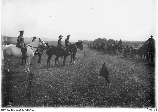 War's end: The Australian 3rd Machine Gun Battalion marches past General Monash towards the end of the war. Picture: Australian War Memorial EO 2145