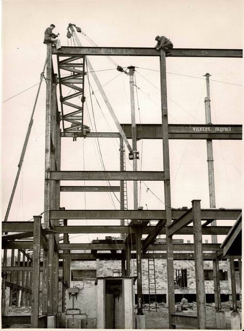 OHS - what OHS: Builders on the job aligning a steel beam, photographed The Courier July 12 1954. Picture: The Courier.