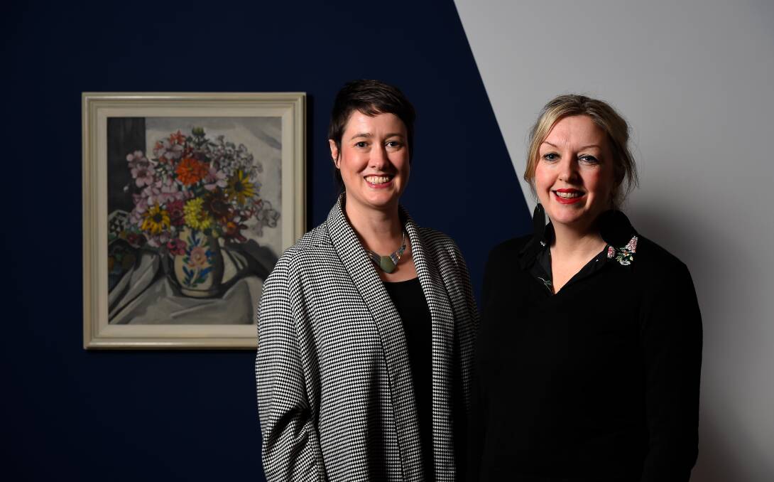 Becoming Modern: curator Julie McLaren and director Louise Tegart with a 1929 work by Australian artist Margaret Preston, Jug of Flowers. Picture: Adam Trafford.