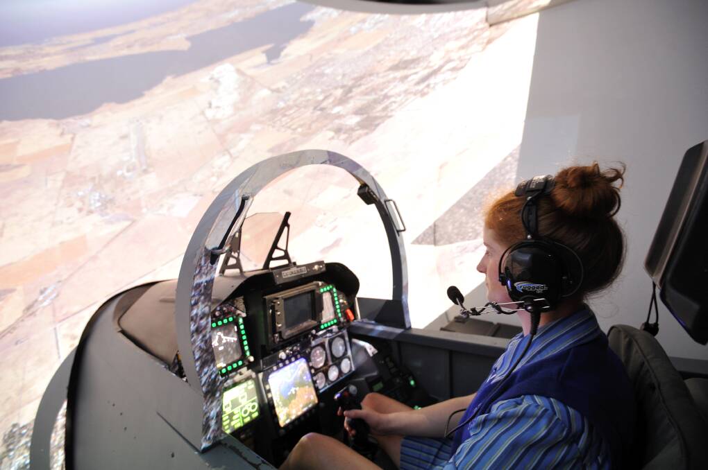 RAAF Hornet simulator: Loreto College Year 12 student Ailish Murphy-McKay pilots over Point Cook in the simulation. Picture: Lachlan Bence.