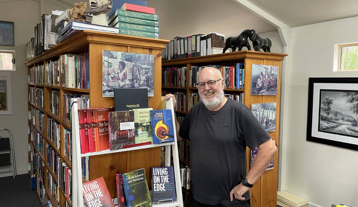 Writing helps me focus: Professor Smyth in his writing studio and library of 12,000 books. He is an emeritus professor at Federation University, has written 40 books and 4000 scholarly papers. Picture: Caleb Cluff.