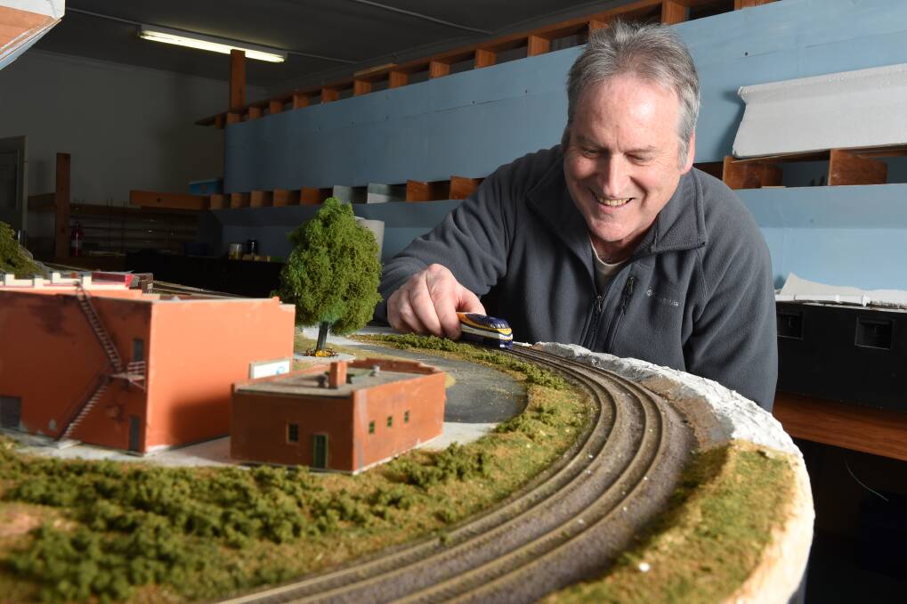 A joy of building: Gary Kennedy says planning and building the layouts gives him as much pleasure as running the trains. Picture: Kate Healy
